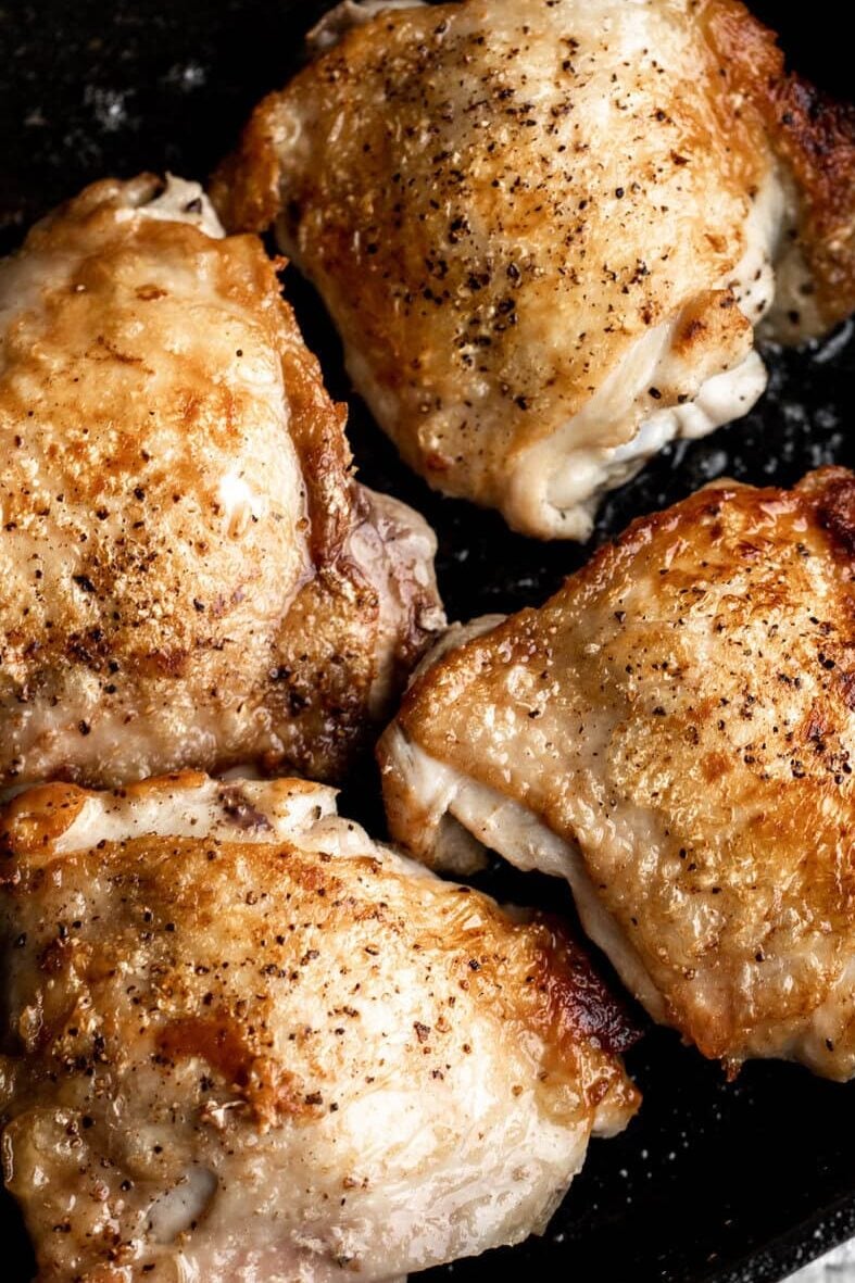 seared crispy bone in skin onchicken thighs.