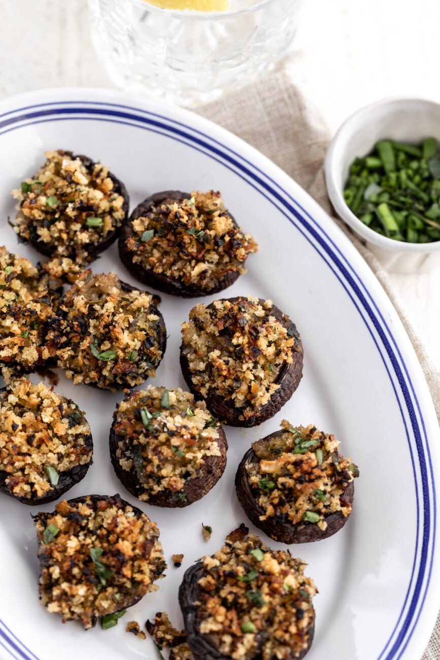 herb stuffed mushrooms on platter.