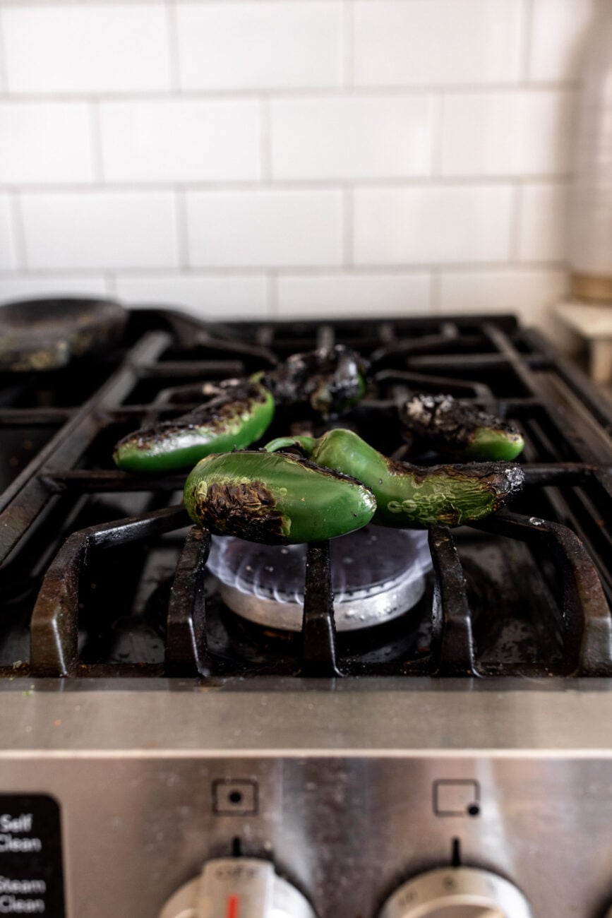 charred jalapeños on stove.