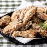 baked chicken wings with roasted jalapeño Alabama white sauce.