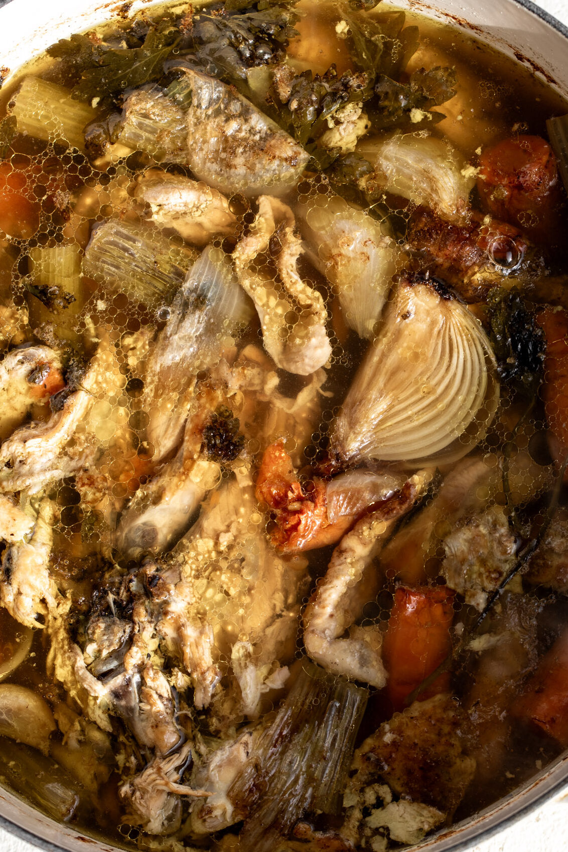 slowly simmered chicken stock with bones and vegetables.