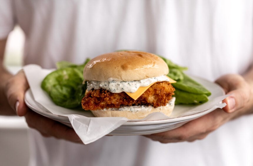 homemade filet o fish sandwich with butter lettuce salad.