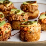 how to make crispy rice the nobu method topped with spicy tuna and salmon with avocado.