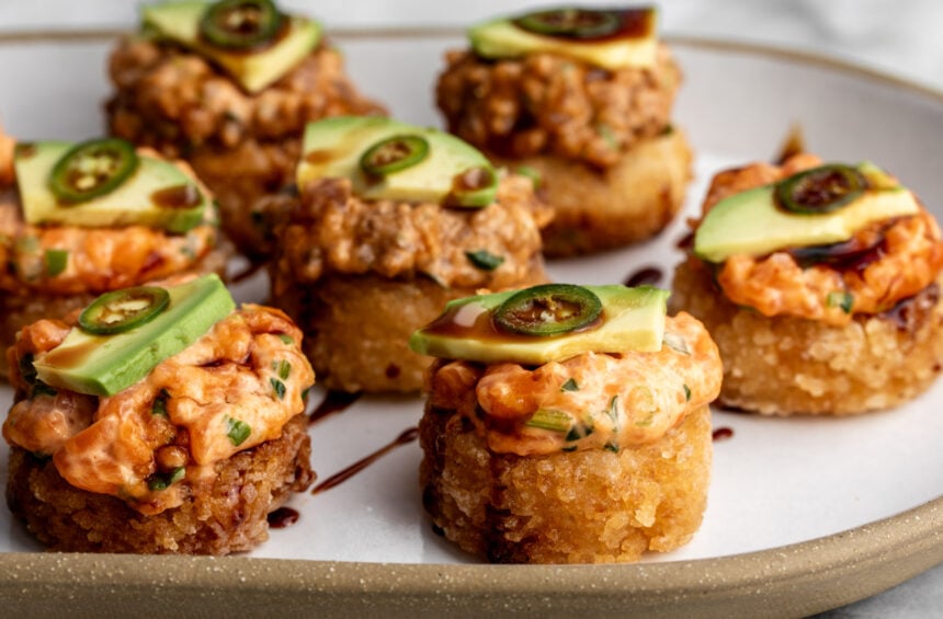 how to make crispy rice the nobu method topped with spicy tuna and salmon with avocado.