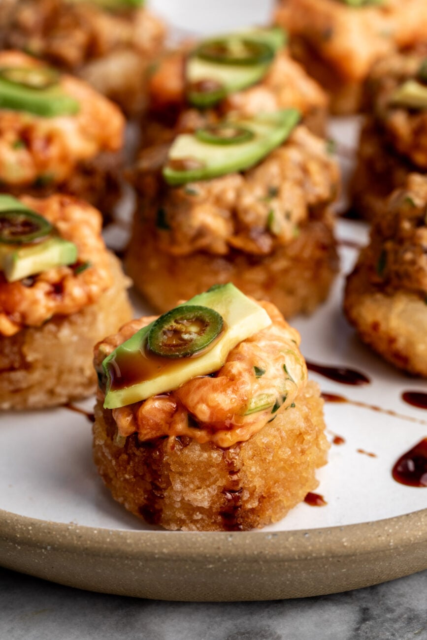how to make crispy rice the nobu method topped with spicy tuna and salmon with avocado.