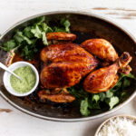 peruvian whole roast chicken with aji verde green sauce.