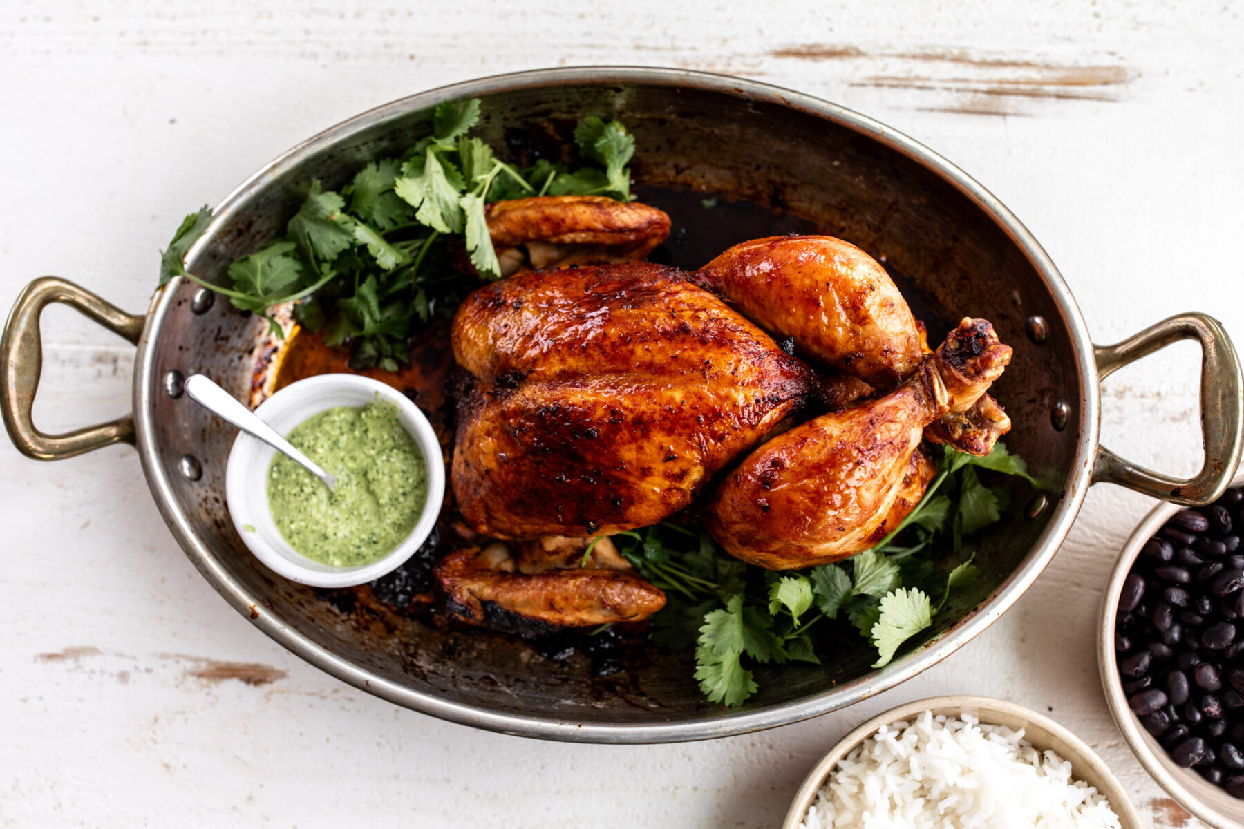 peruvian whole roast chicken with aji verde green sauce.