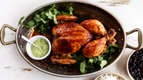 peruvian whole roast chicken with aji verde green sauce.