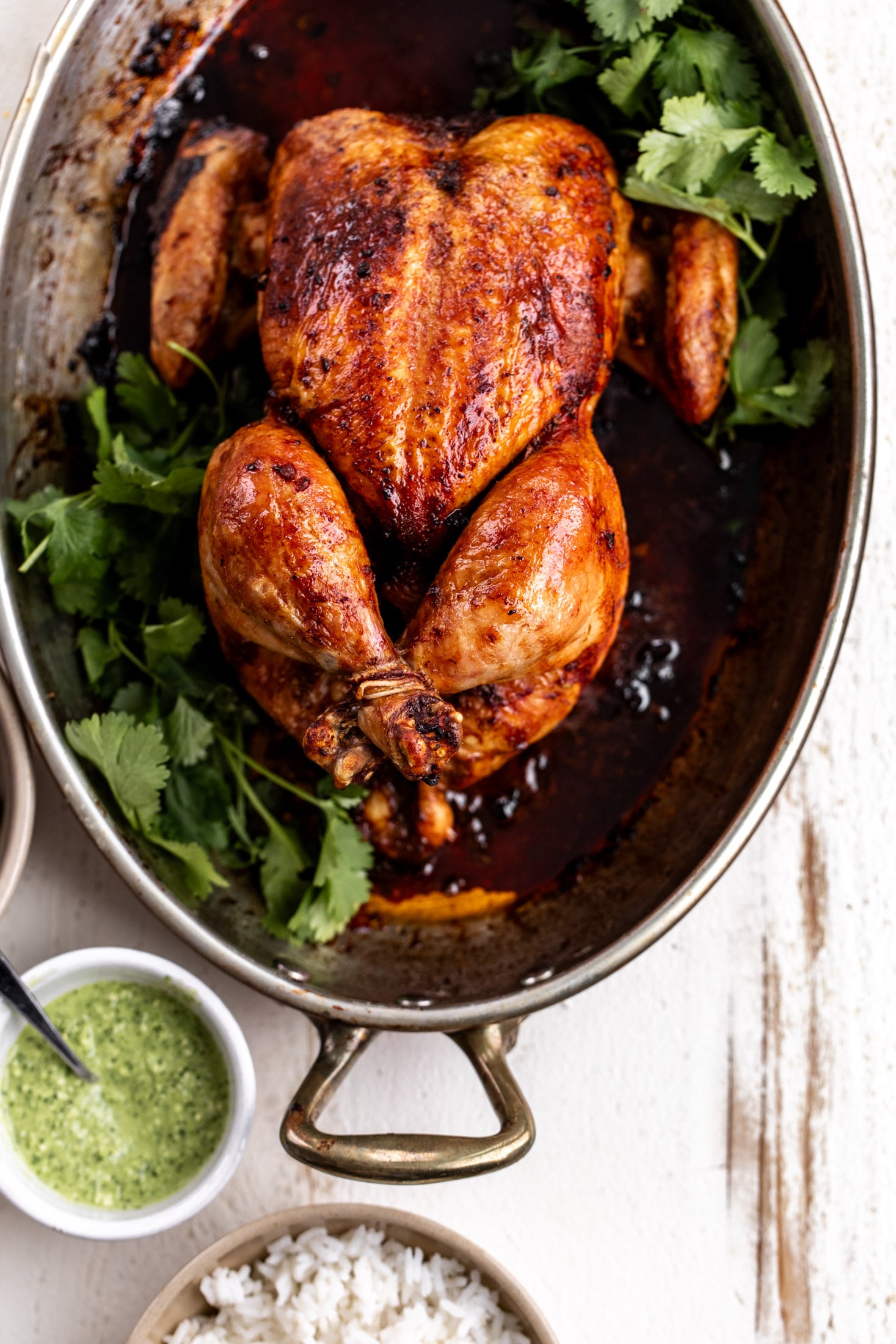 peruvian whole roast chicken with aji verde green sauce.