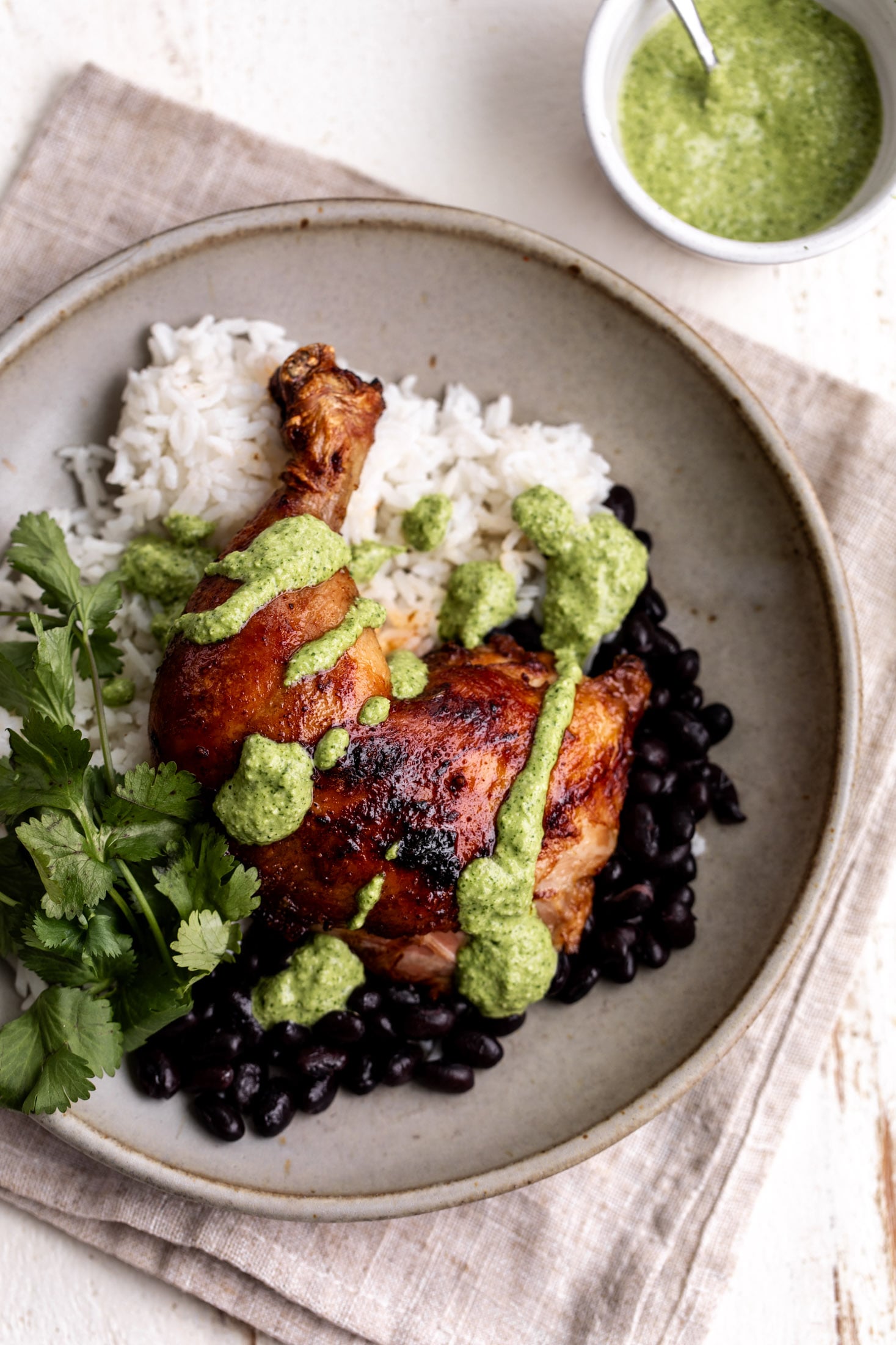 whole leg of peruvian chicken with aji verde over rice. 