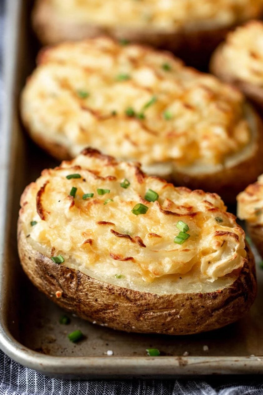 Cheesy Cheddar Twice Baked Potatoes on baking sheet.