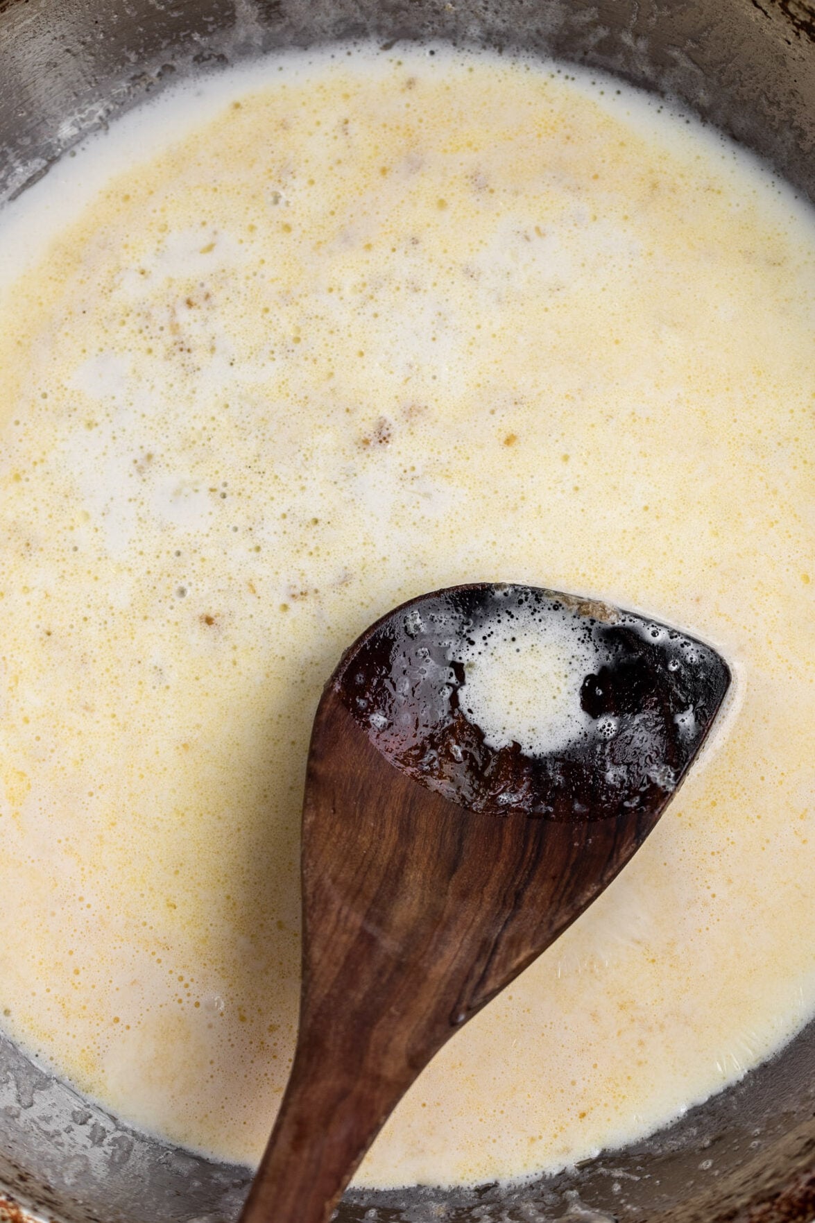 sauteéed garlic butter with cream in pan.
