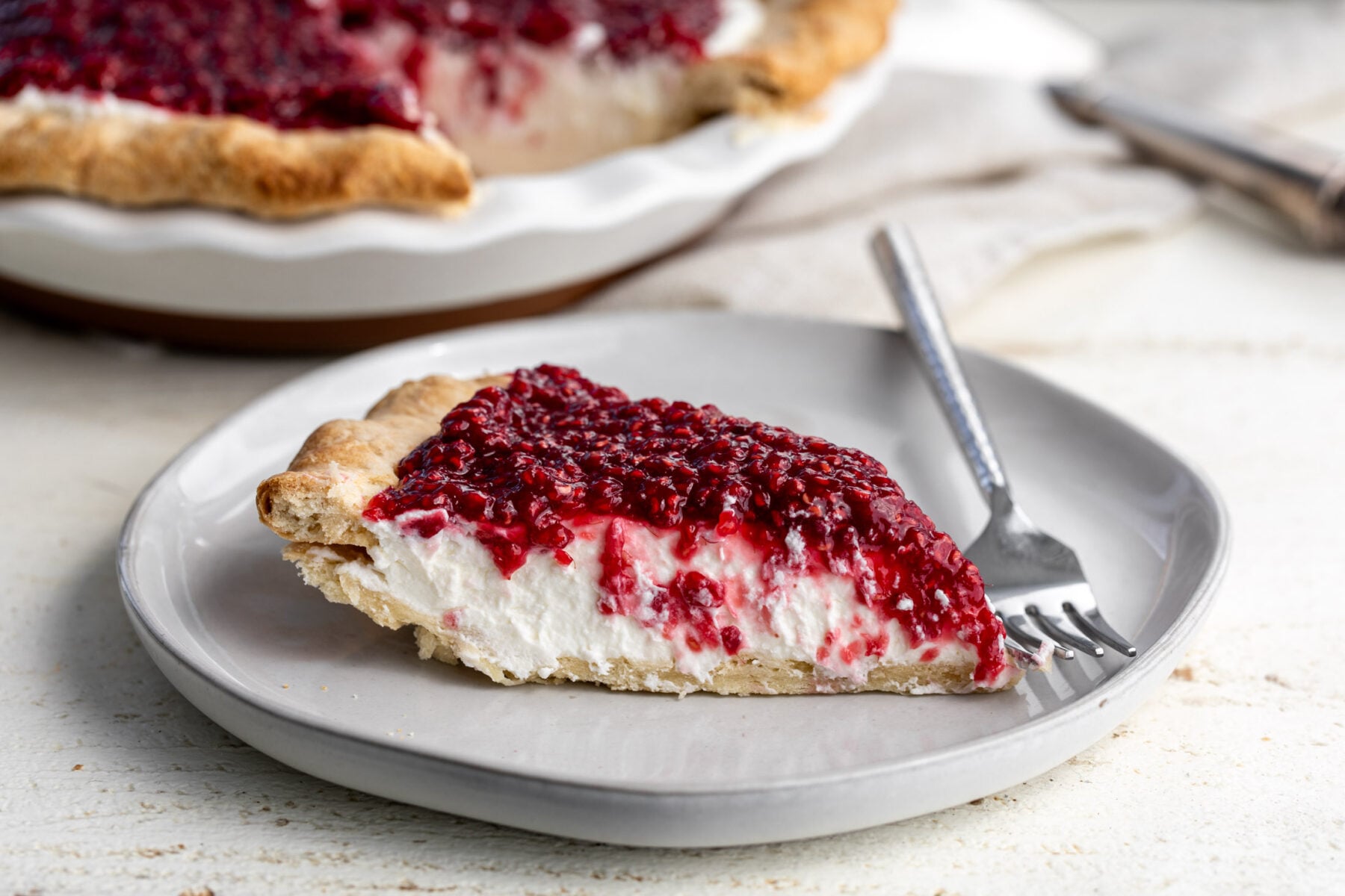 Raspberry Cream Pie Recipe (Briarmere Farms Copycat) piece on plate.