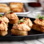 dynamite lobster crispy rice topped with sriracha and green onion.