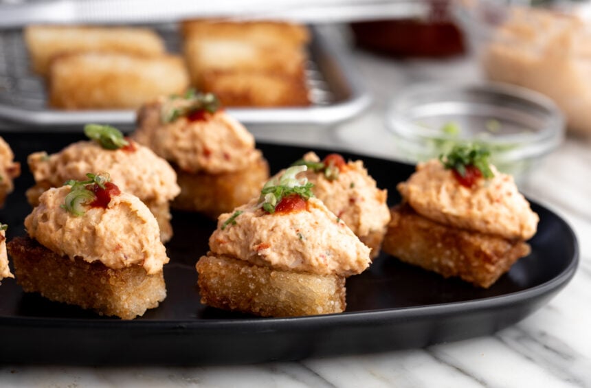 dynamite lobster crispy rice topped with sriracha and green onion.