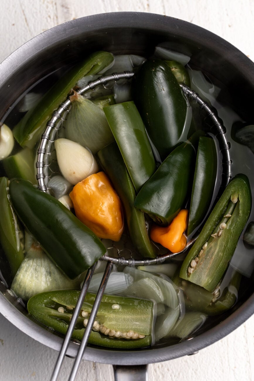simmered jalapeños, habaneros, garlic and onions.