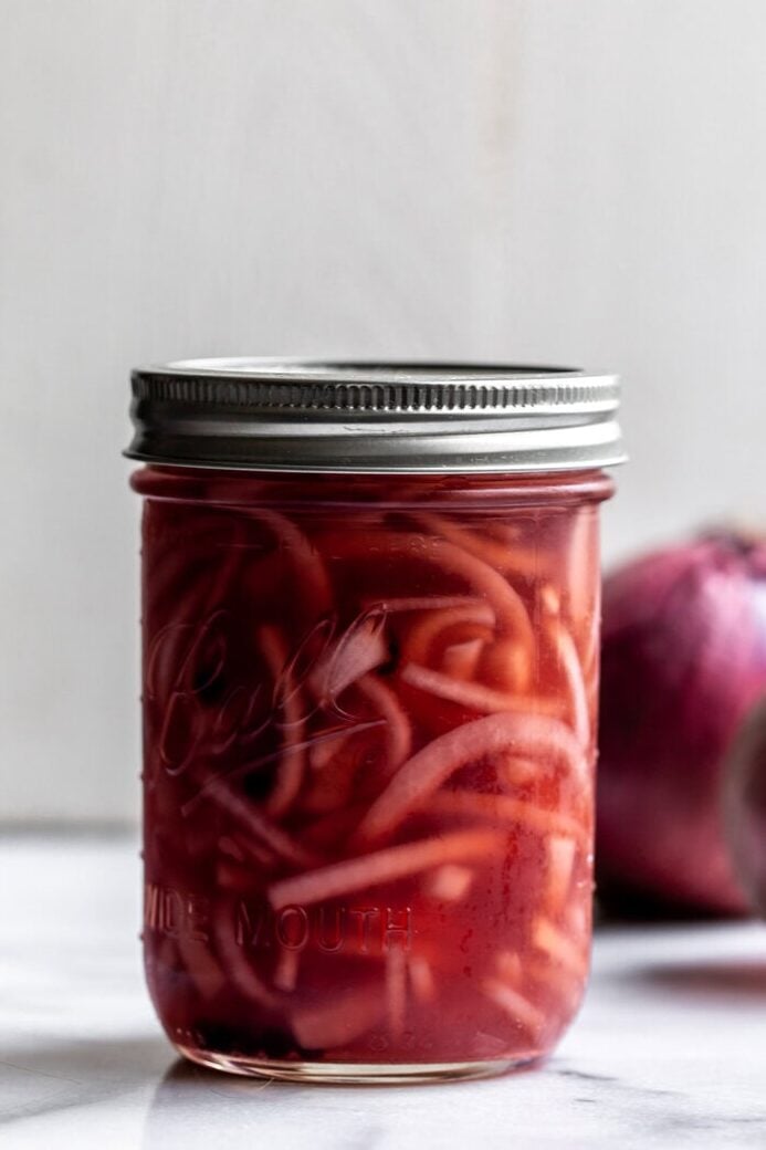 Quick pickled red onion recipe condiment.