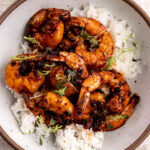 honey garlic chili crisp shrimp over white rice.