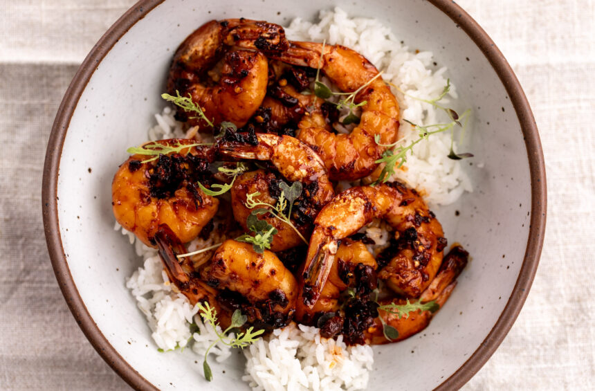 honey garlic chili crisp shrimp over white rice.