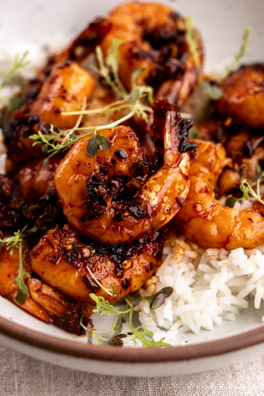 honey garlic chili crisp shrimp over white rice.