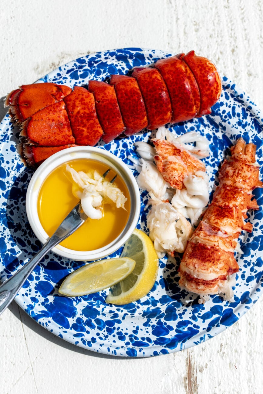 how to boil lobster tails with lemon wedge and dipped in clarified butter.