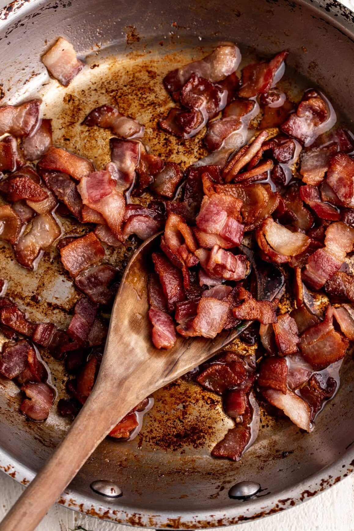 diced sautéed crispy bacon cooked in pan.
