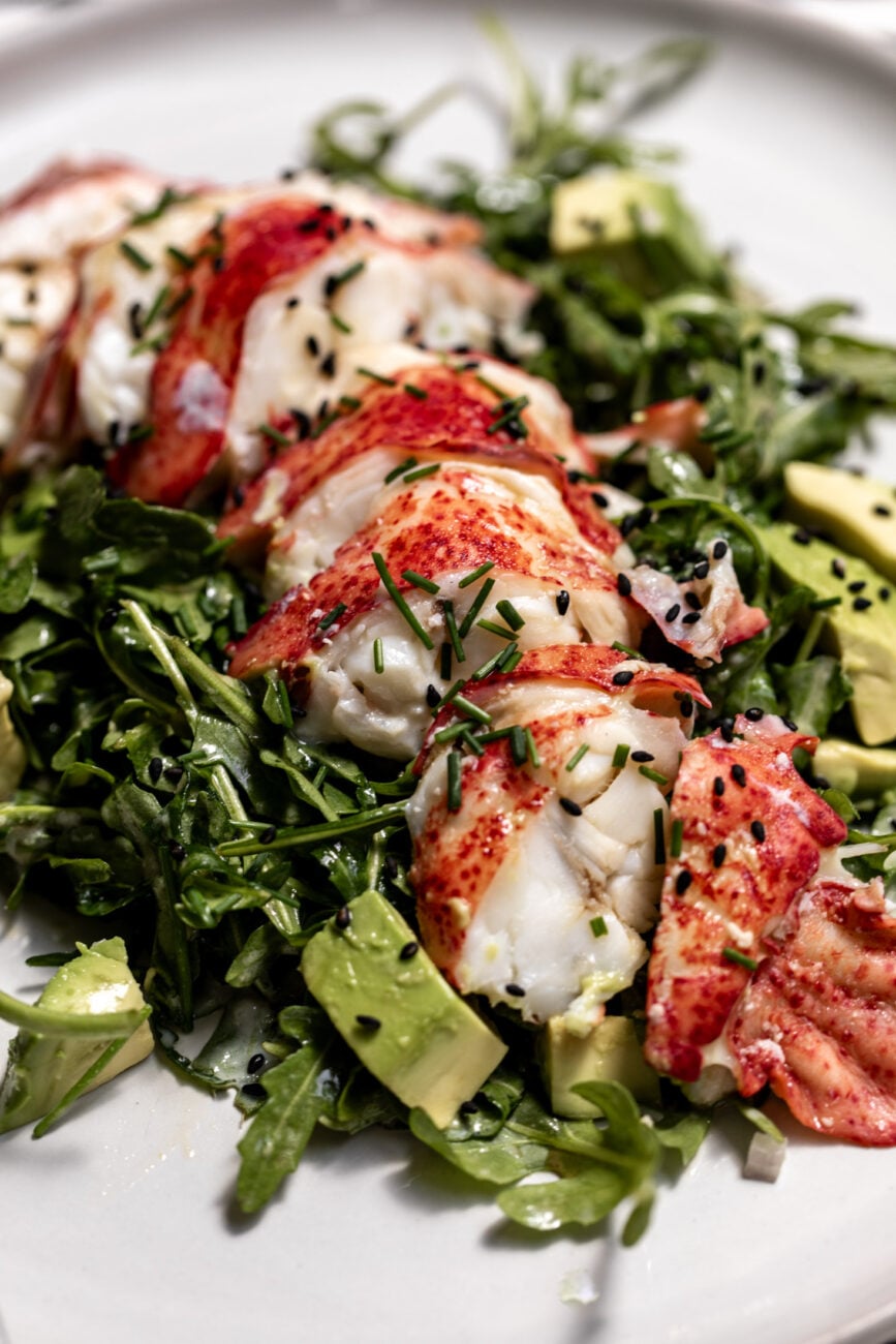 lobster avocado salad with creamy tofu lime dressing with arugula and avocado.