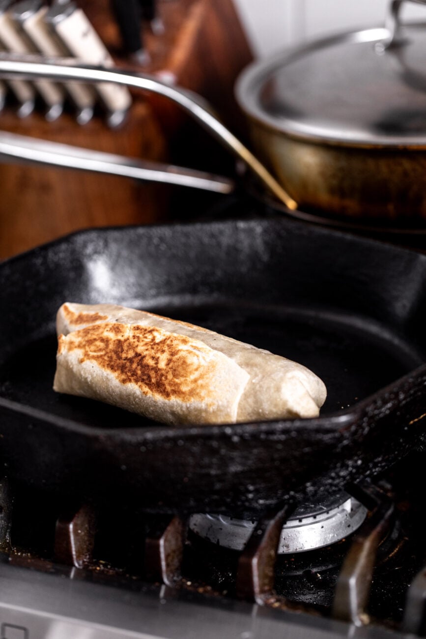 burrito browned in cast iron pan to secure the ingredients. 