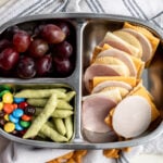 homemade lunchables with cheese and crackers in bento box.