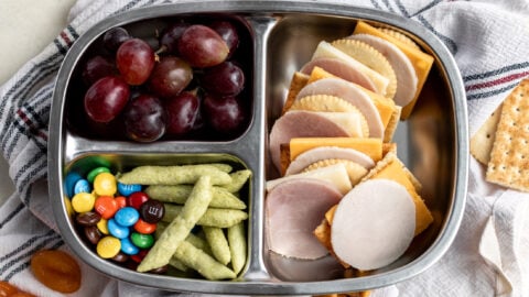 homemade lunchables with cheese and crackers in bento box.