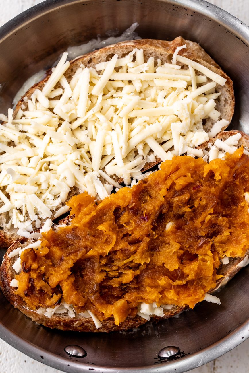 shredded Cheddar cheese with mashed butternut squash.