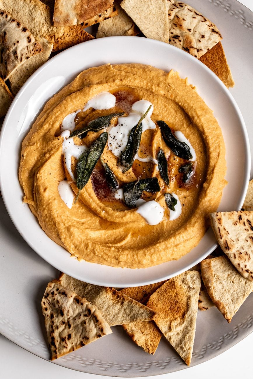 sweet potato hummus topped with sage brown butter and creme fraiche with pita chips.