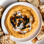 sweet potato hummus topped with sage brown butter and creme fraiche with pita chips.