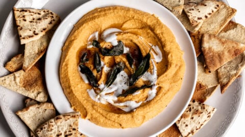sweet potato hummus topped with sage brown butter and creme fraiche with pita chips.