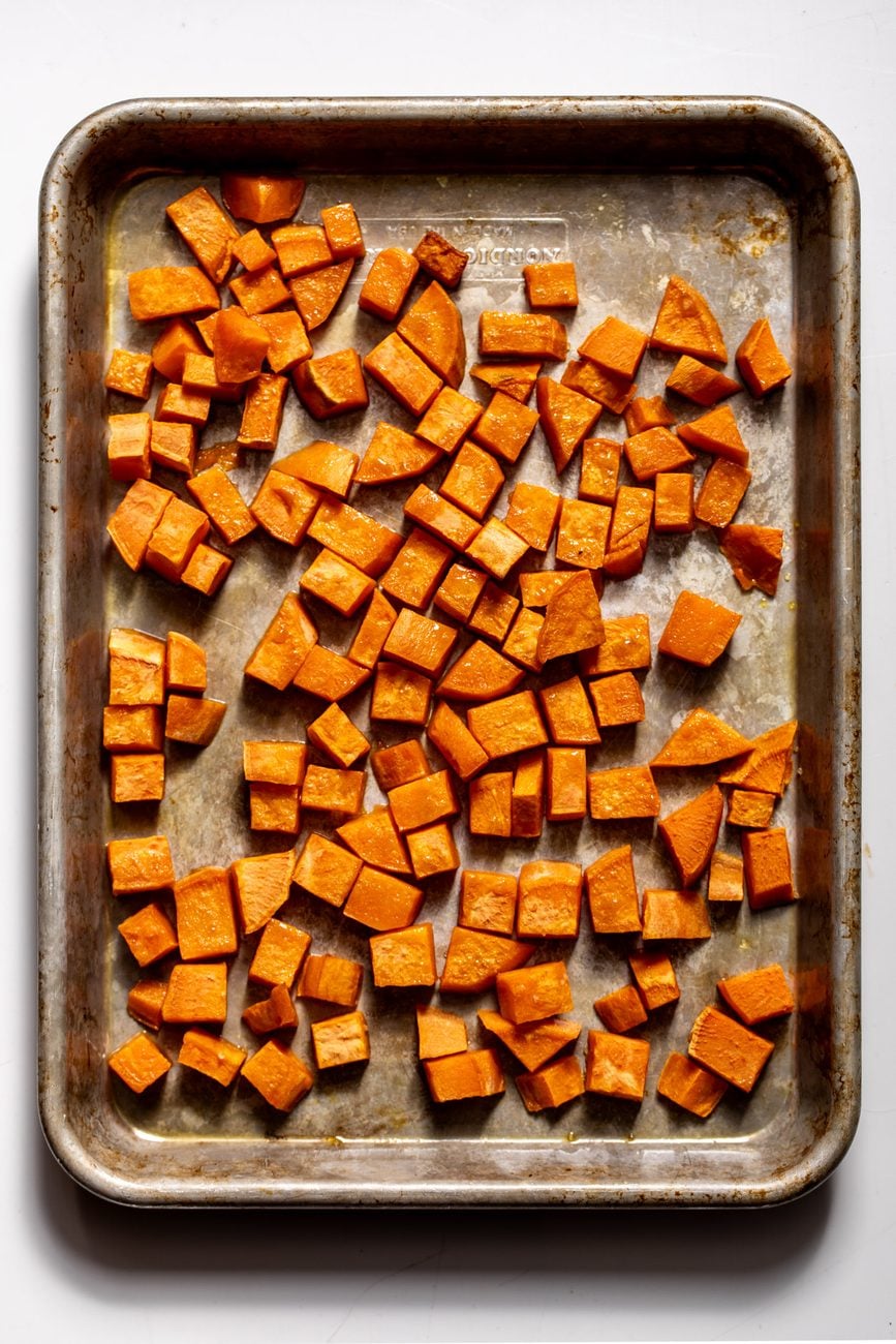 roasted diced sweet potatoes on baking sheet.
